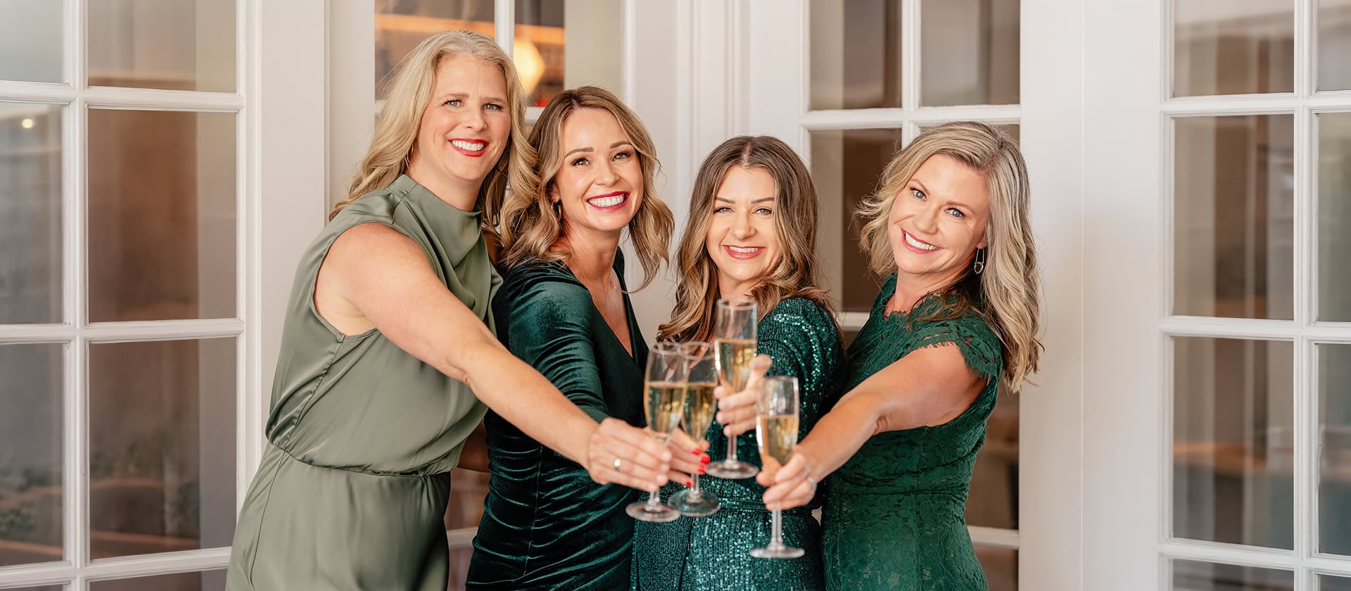 The Bliss Events team raising a champagne toast to celebrate another San Diego wedding.