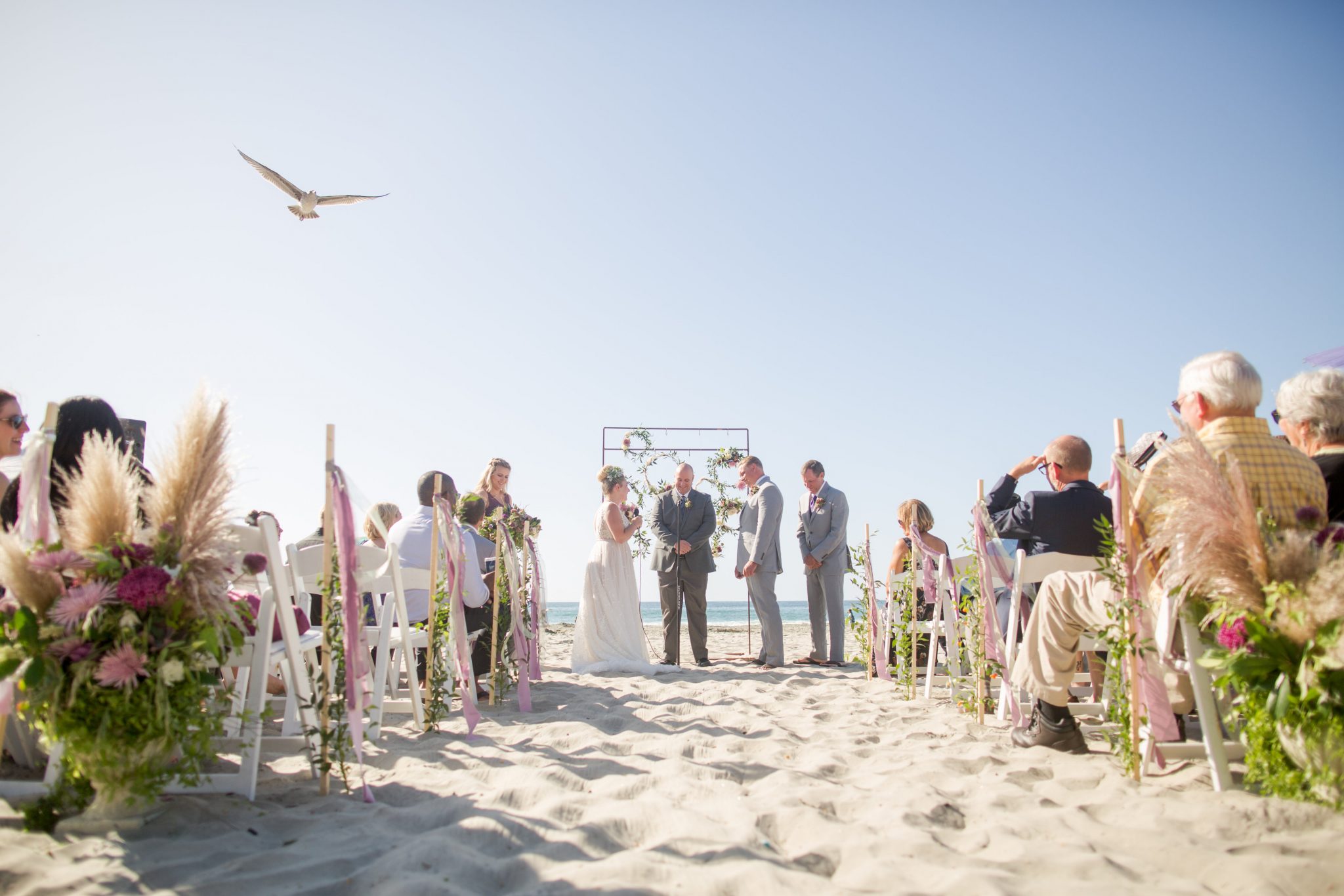 Heather and Max during their beach wedding ceremony