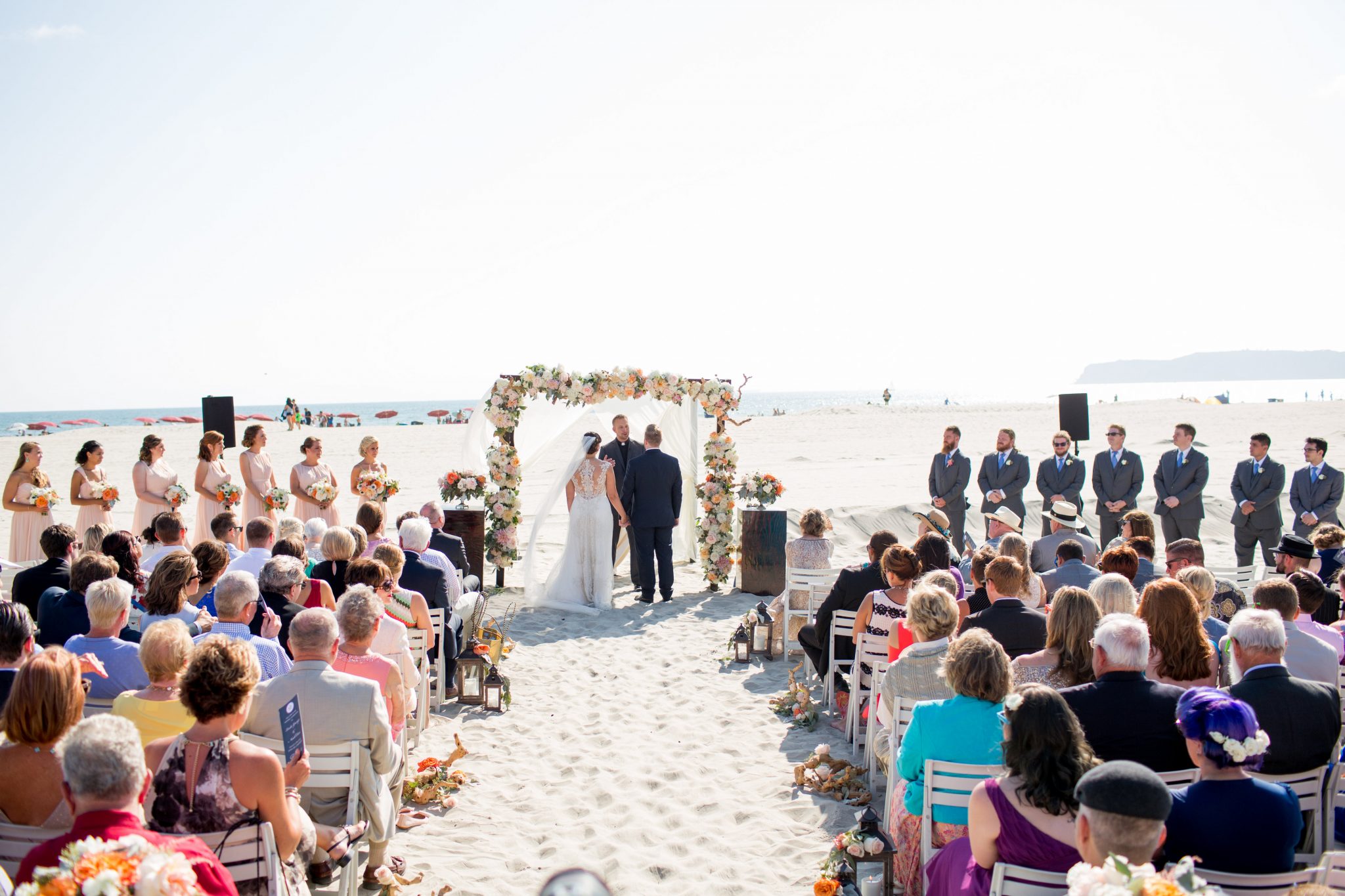 Beach glamour wedding ceremony coordinated by Bliss Events on the Coronado beach