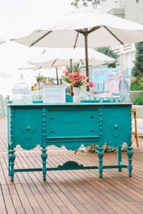 Turquoise table for check in at Kelly and Kyle's Bliss Events wedding