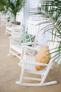 Relaxed modern tropical seating in white rocking chairs